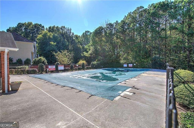 view of swimming pool featuring a patio