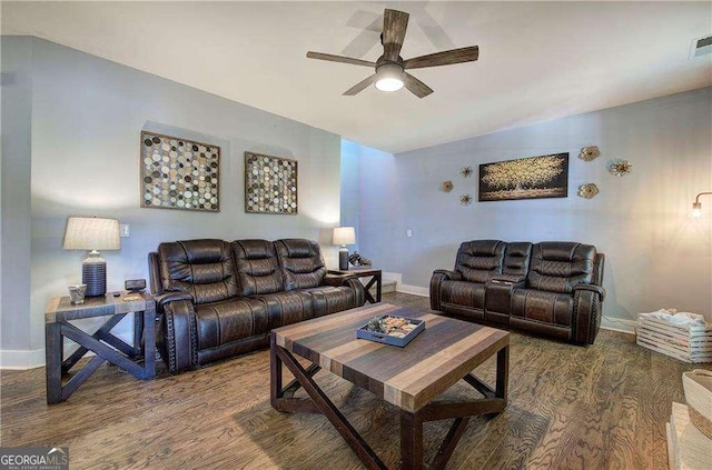 living room featuring dark hardwood / wood-style flooring and ceiling fan