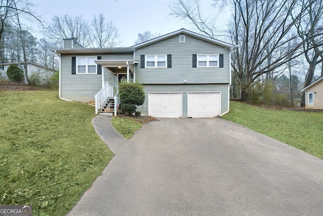 view of front of house featuring a garage and a front yard