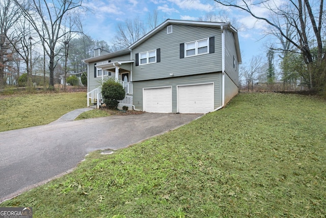 view of front of home with a garage and a front yard