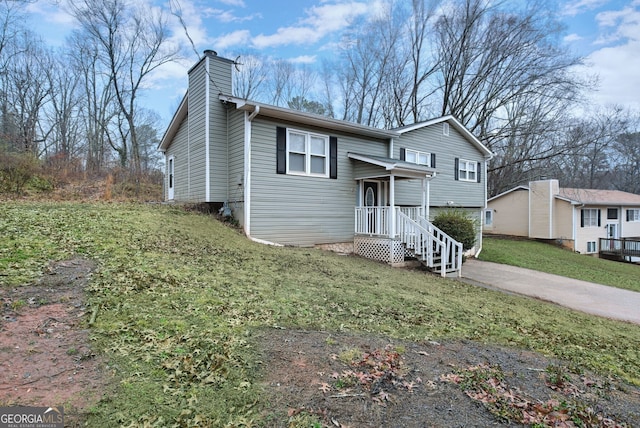 bi-level home with a front yard