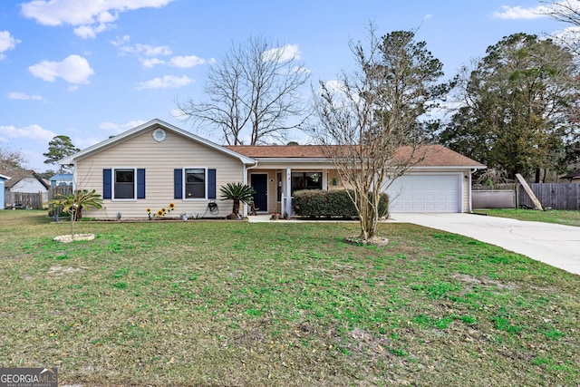 ranch-style home featuring a garage and a front lawn