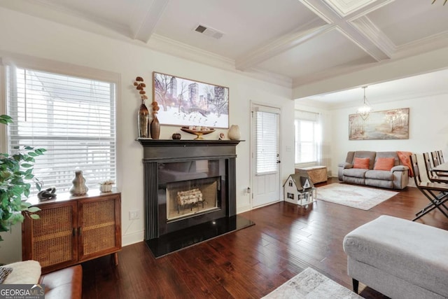 living room with dark hardwood / wood-style flooring, beam ceiling, coffered ceiling, and crown molding