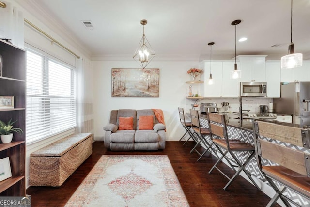 living room with ornamental molding and dark wood-type flooring