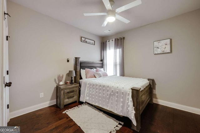 bedroom featuring ceiling fan and dark hardwood / wood-style flooring