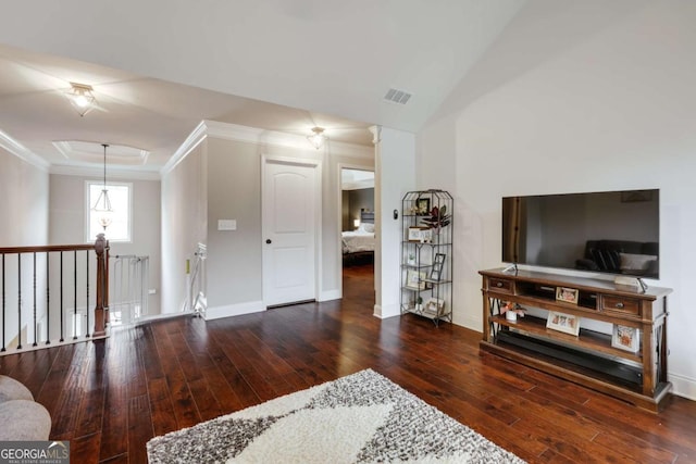 living room featuring crown molding, vaulted ceiling, and dark hardwood / wood-style flooring