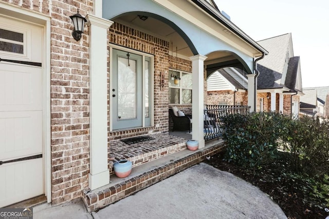 entrance to property featuring covered porch