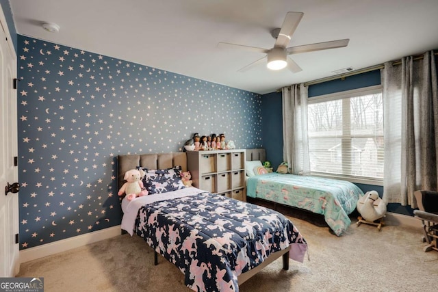 bedroom featuring ceiling fan and light carpet