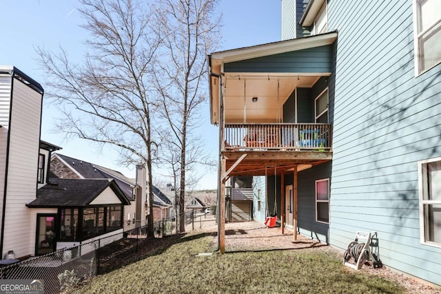 rear view of property with a yard