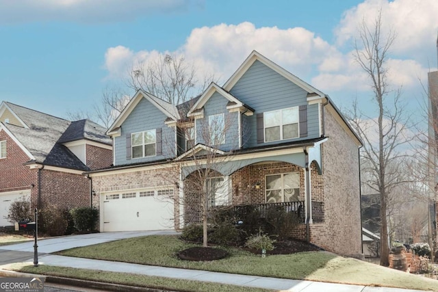 view of front of house with a garage, a front lawn, and a porch