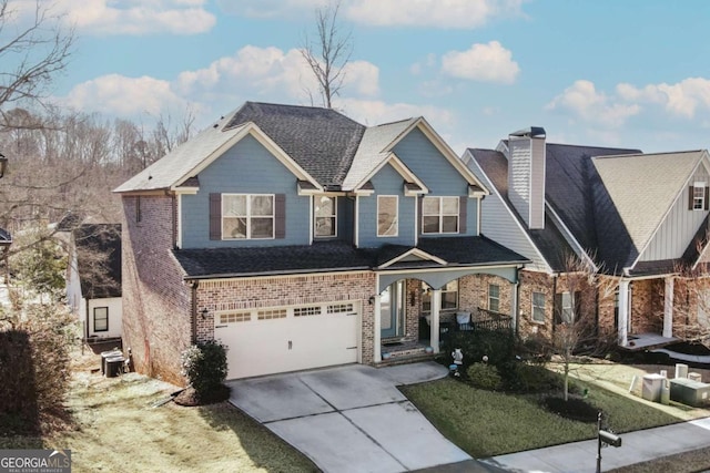 view of front of home with a garage and a front lawn