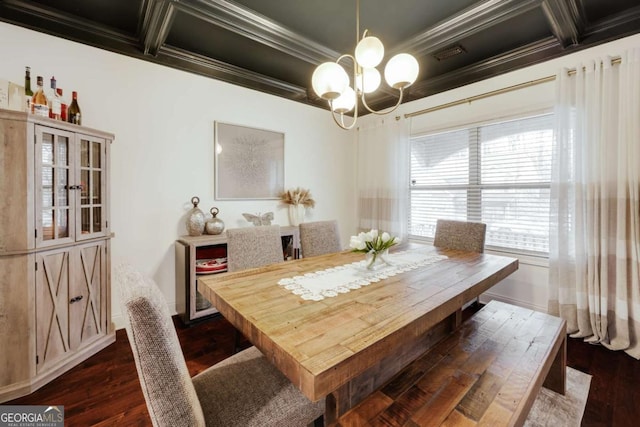 dining area with ornamental molding, a notable chandelier, and dark hardwood / wood-style flooring