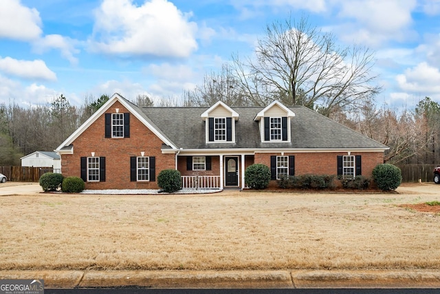 view of front facade with a porch and a front lawn