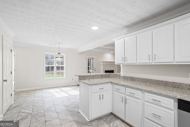 kitchen with pendant lighting, white cabinetry, ornamental molding, stainless steel dishwasher, and kitchen peninsula