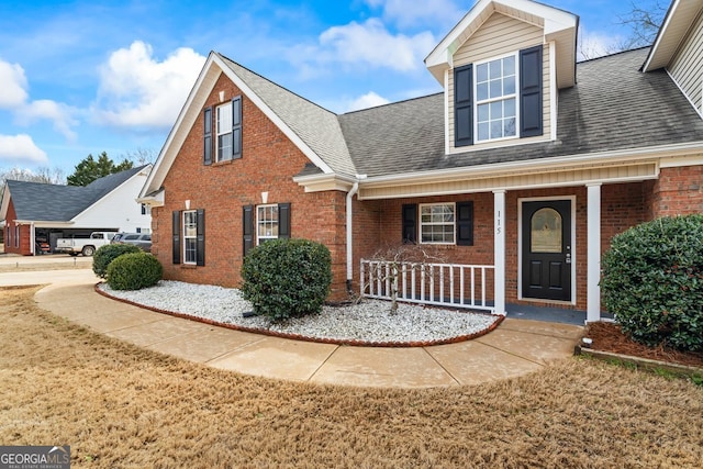 view of front of home featuring a front yard and a porch