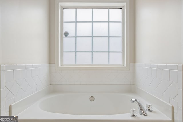 bathroom with a washtub