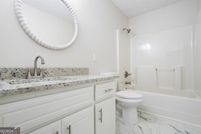 full bathroom with vanity, a textured ceiling, shower / bathtub combination, and toilet