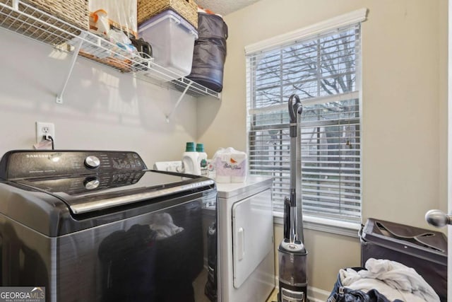 washroom featuring separate washer and dryer