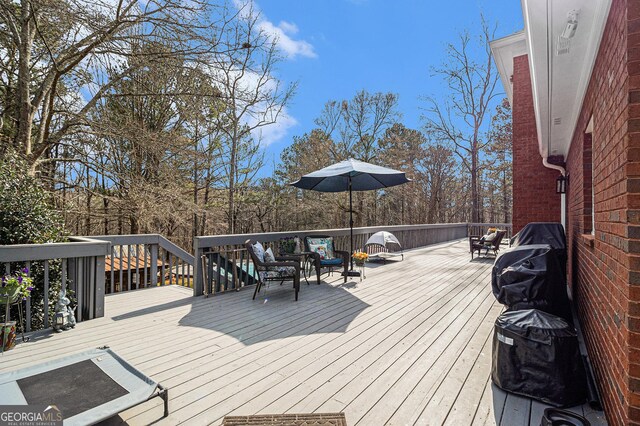 wooden deck with an outdoor pool