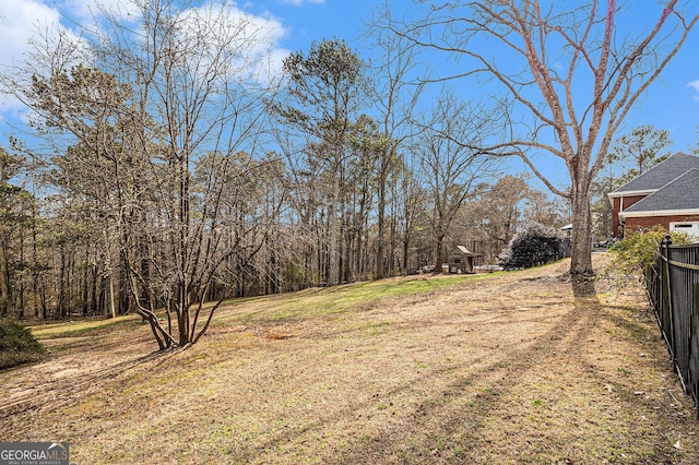 view of yard featuring fence