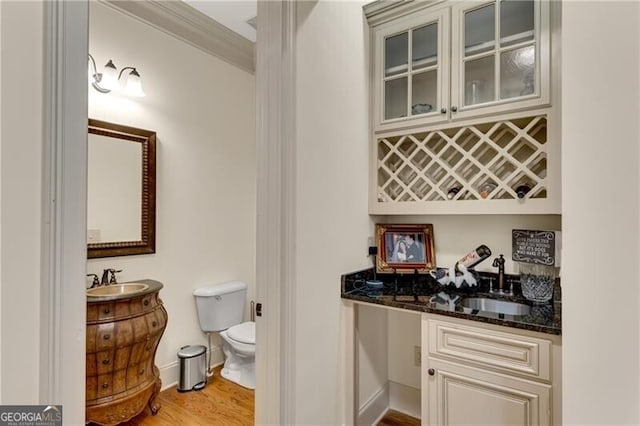 5861 Yoshino Cherry Ln, Braselton, GA 30517 - indoor wet bar featuring light wood-style floors and ornamental molding