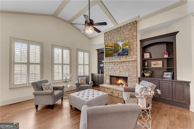 5861 Yoshino Cherry Ln, Braselton, GA 30517 - living room with ceiling fan, a fireplace, high vaulted ceiling, and light hardwood / wood-style flooring