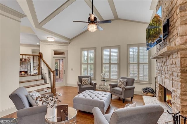 5861 Yoshino Cherry Ln, Braselton, GA 30517 - living room featuring a stone fireplace, plenty of natural light, high vaulted ceiling, and light wood-type flooring