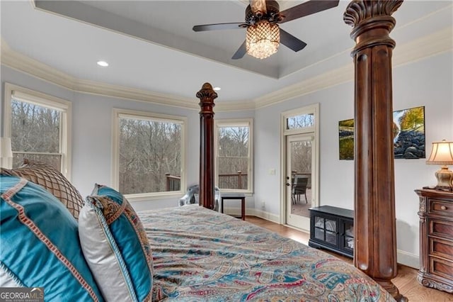 5861 Yoshino Cherry Ln, Braselton, GA 30517 - bedroom featuring crown molding, hardwood / wood-style floors, ceiling fan, and a tray ceiling