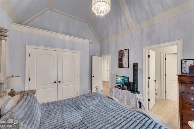 5861 Yoshino Cherry Ln, Braselton, GA 30517 - tiled bedroom with high vaulted ceiling, a closet, and a notable chandelier