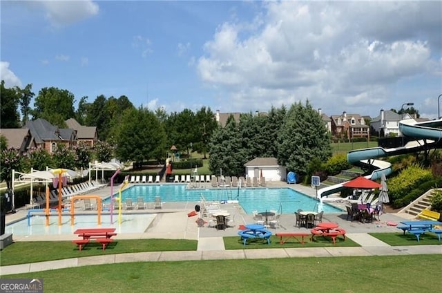 5861 Yoshino Cherry Ln, Braselton, GA 30517 - view of swimming pool with a yard, a patio, and a water slide