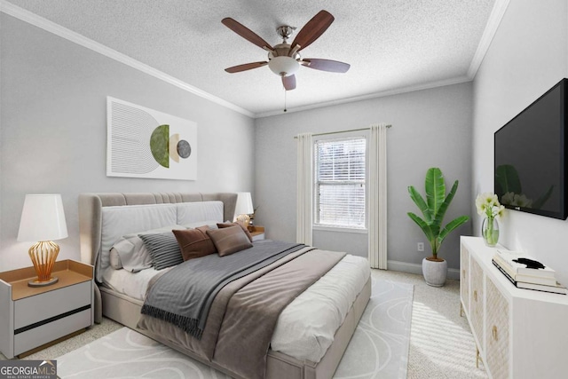 carpeted bedroom featuring ornamental molding, ceiling fan, and a textured ceiling