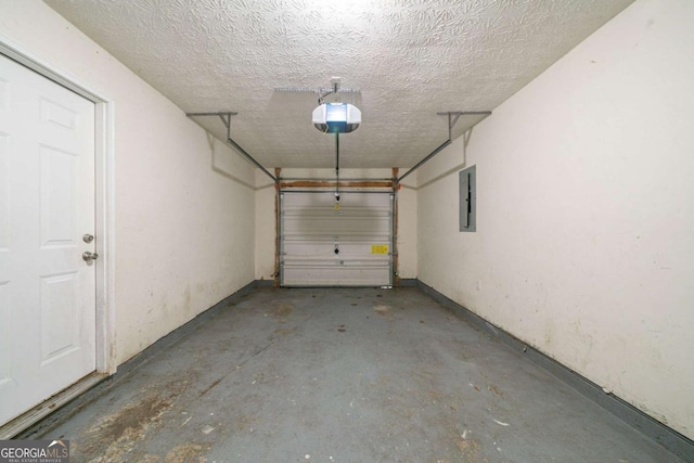 garage featuring a garage door opener and electric panel