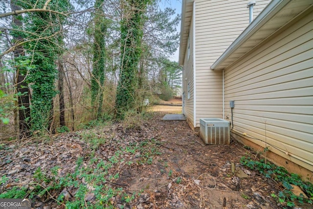 view of yard with central AC unit