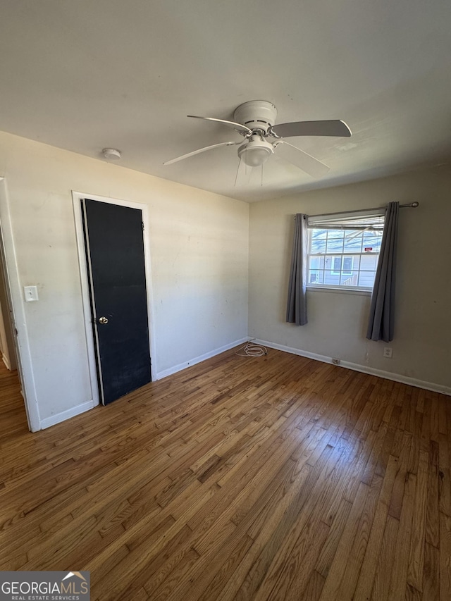 unfurnished bedroom with hardwood / wood-style flooring and ceiling fan