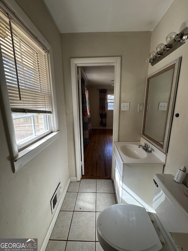 bathroom featuring tile patterned flooring and vanity