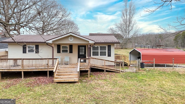 back of house with a yard and a carport