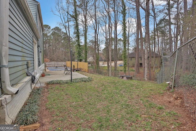 view of yard with a patio area and fence