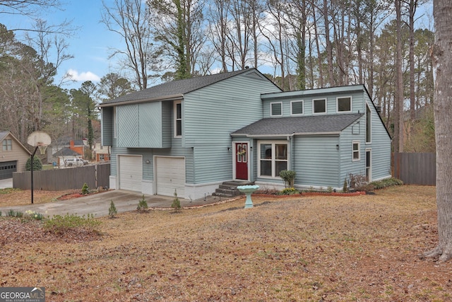 view of front facade with a garage, concrete driveway, fence, and a shingled roof