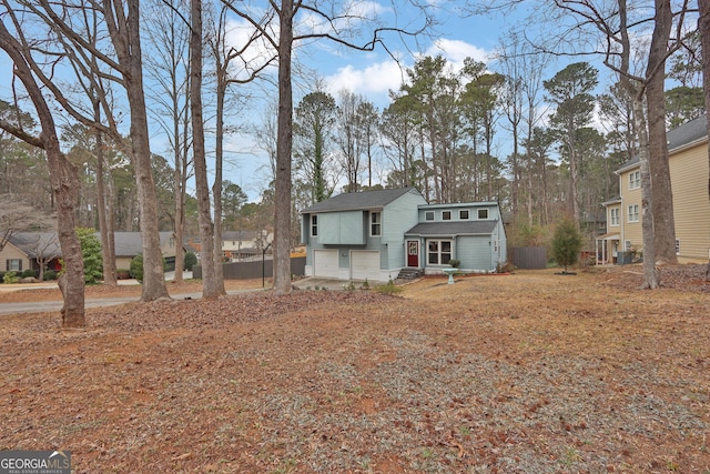 view of front of property with a garage and driveway