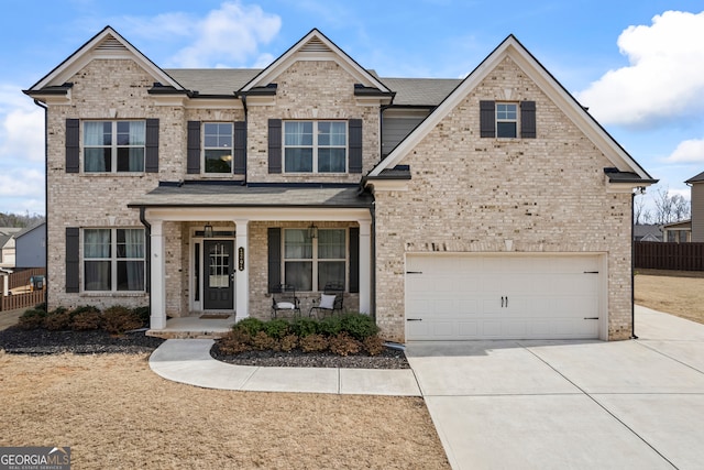 view of front of property with a garage and covered porch