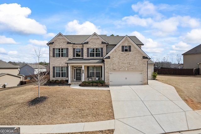 view of front of house with a porch and a garage