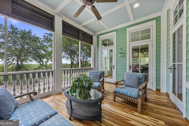 sunroom featuring coffered ceiling and ceiling fan