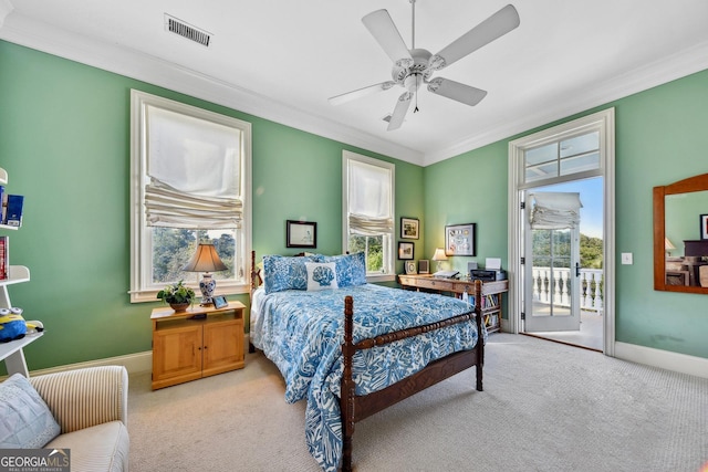 bedroom featuring ornamental molding, light carpet, access to exterior, and ceiling fan