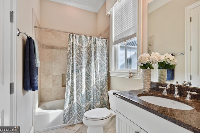 full bathroom featuring tile patterned flooring, vanity, ornamental molding, toilet, and shower / bath combo with shower curtain