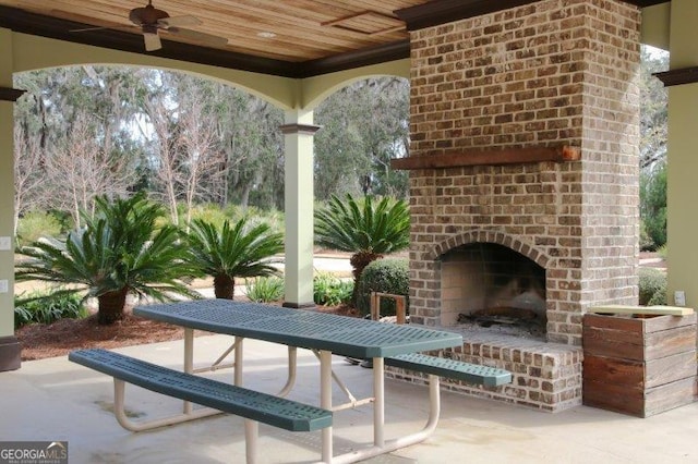 view of patio / terrace with an outdoor brick fireplace