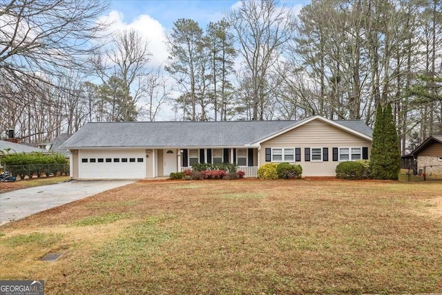 ranch-style house with a garage and a front lawn