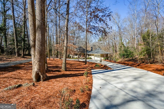 exterior space featuring concrete driveway