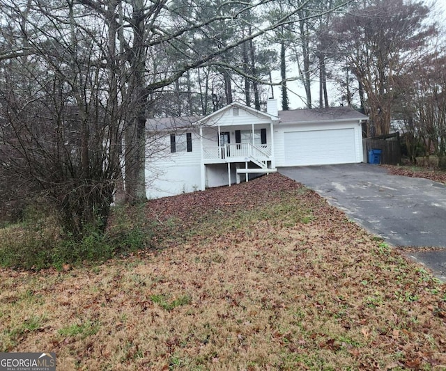 view of front of property with a garage and covered porch