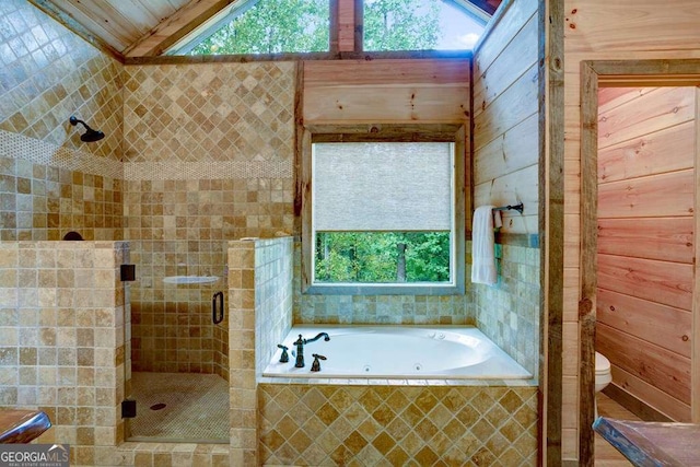 bathroom featuring toilet, plus walk in shower, and vaulted ceiling