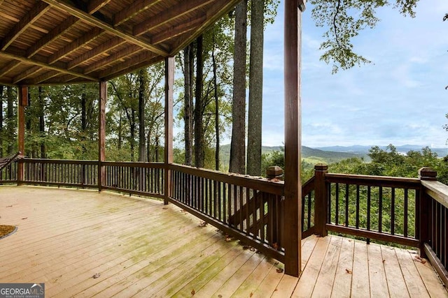 wooden terrace featuring a mountain view